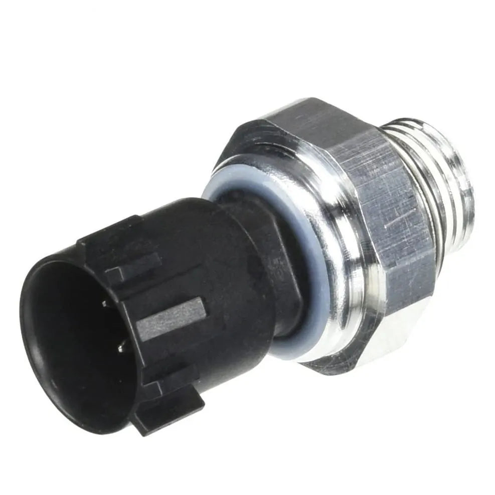 Silver metal automobile fuel pressure sensor on a plain background