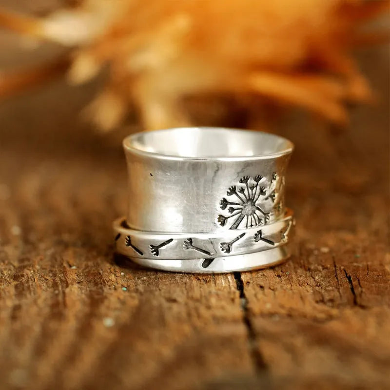 Adjustable silver flower ring with rotatable design fits five finger sizes
