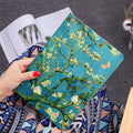 Handmade liquid silicone iPad flip case showing floral artwork design on cover.