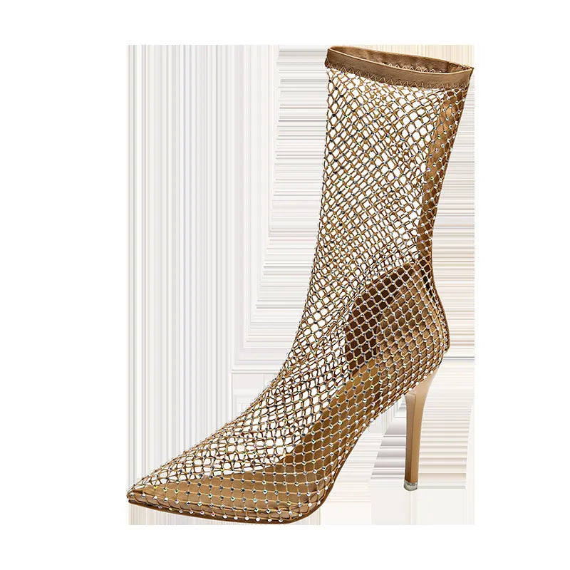 Gold women's pointed toe stiletto high heel sandals with mesh uppers on a white background