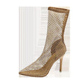 Gold women's pointed toe stiletto high heel sandals with mesh uppers on a white background