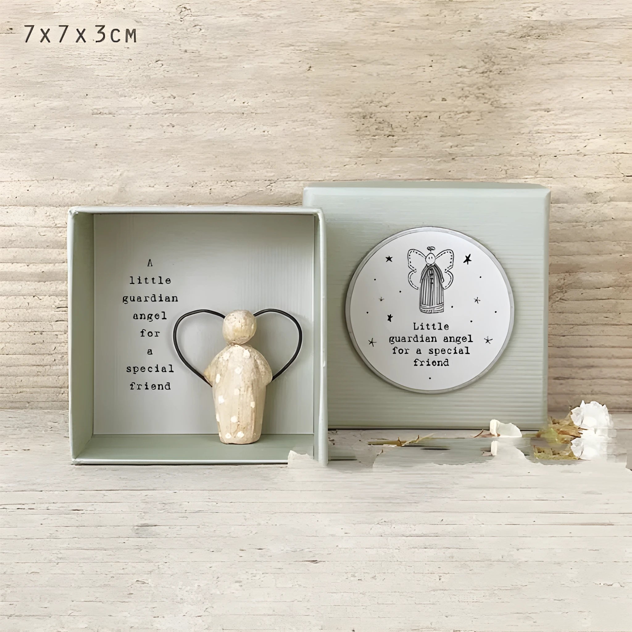 Boxed resin and plastic guardian angel figurine ornament in a modern cartoon style.