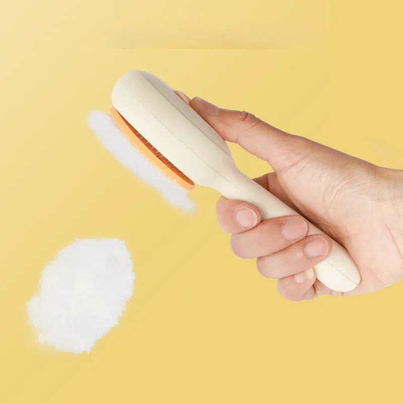 Green and yellow cat grooming brush with stainless steel comb and non-slip handle on a white background.