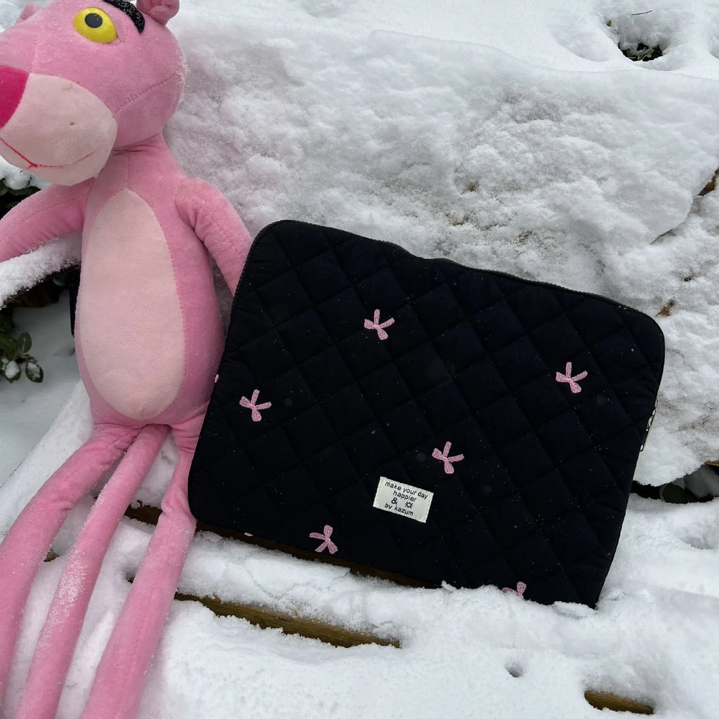 Cute rhombus embroidered bow laptop sleeve in light blue colour, zipper closure.