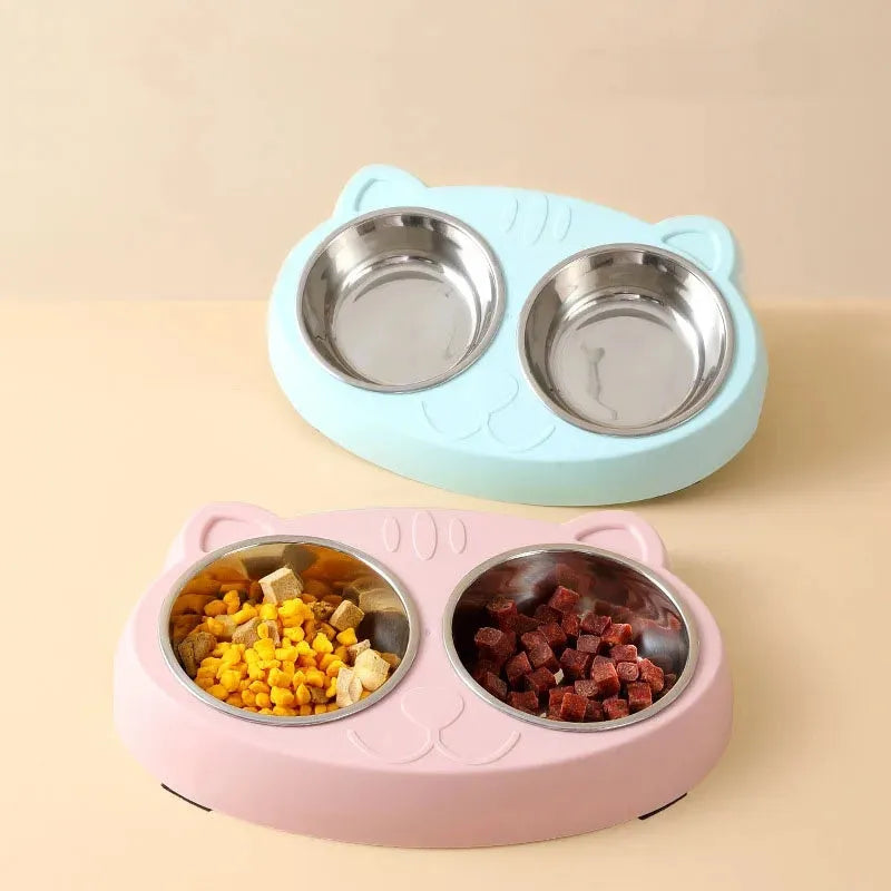 Blue macaron-shaped plastic pet feeder tray with two bowls for food and water.