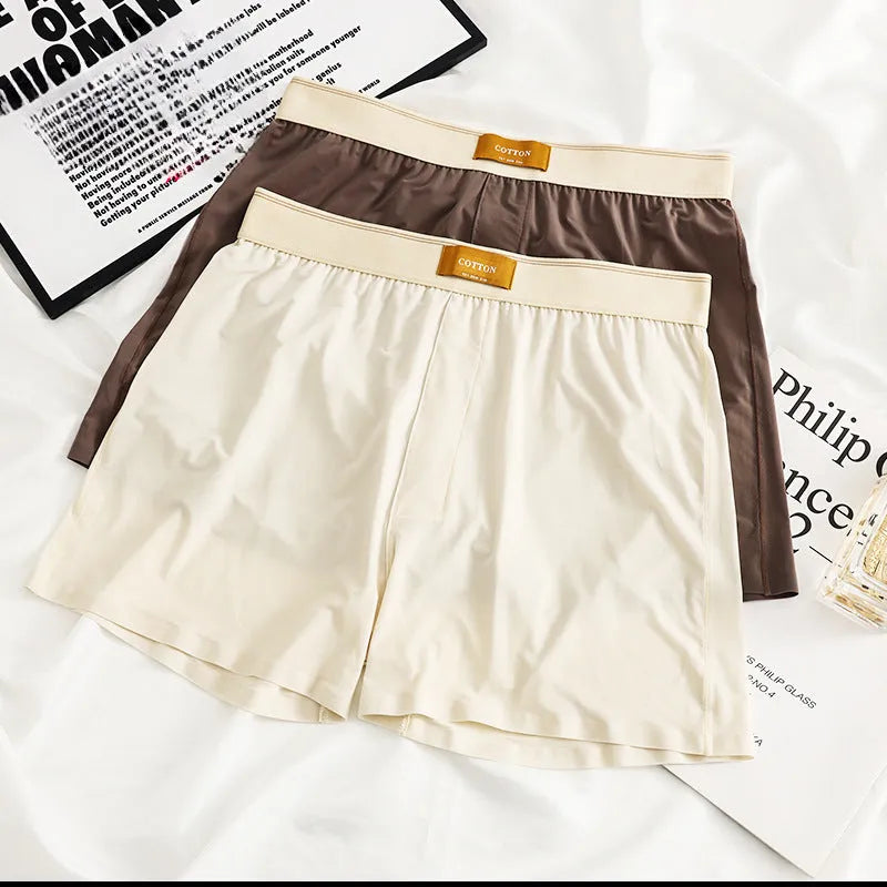 Three pairs of men's solid colour ice silk underwear showing loose fit and mid waist design
