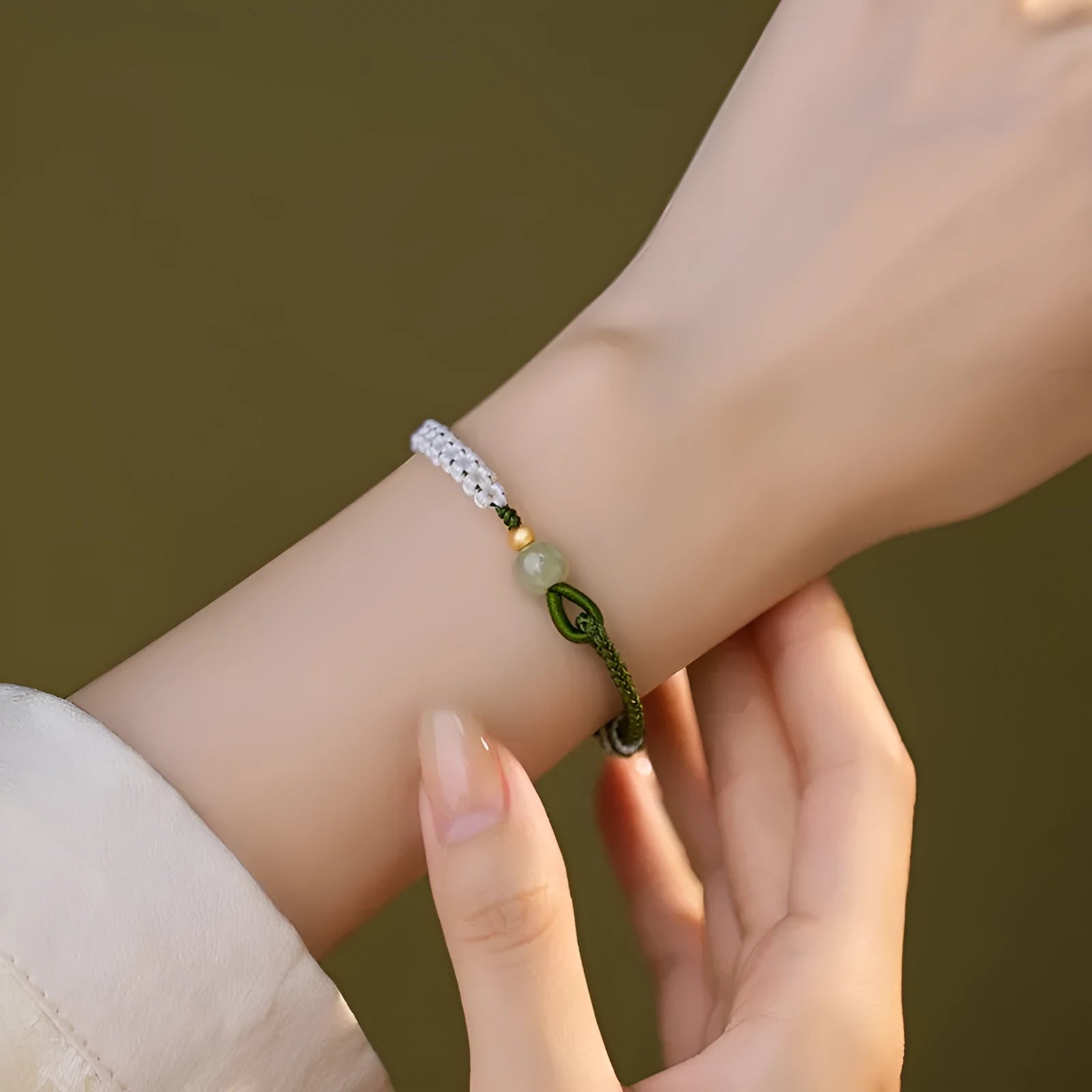 Chinese national bracelet with Hetian jade, sterling silver, and colourful cord carrying strap