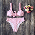 Women's solid colour bikini set in polyester, shown in one of five available colours.