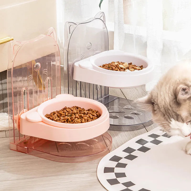 Grey pet feeding bowl with cat ear design and removable hanging cage attachment