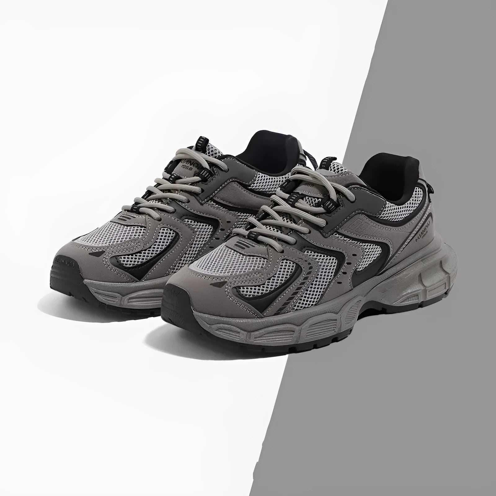 Grey platform dad shoes with PU mesh upper, leather stitching, and a chunky EVA sole.