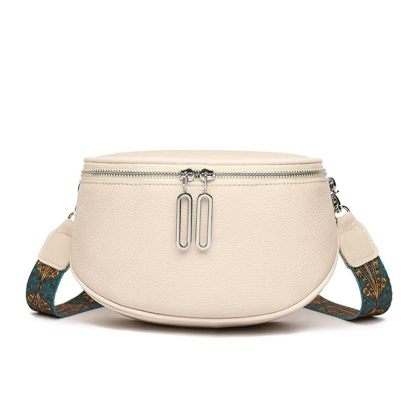 Soft PU leather women's messenger bag in saddle shape with crossbody strap.