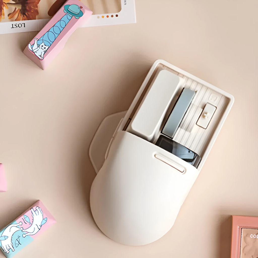 Tofu coloured wireless computer mouse with programmable buttons and scroll wheel on plain background