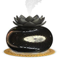 Pure black lotus aromatherapy humidifier with USB cable on desk surface