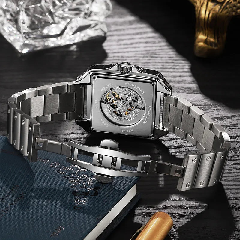Men's square-faced automatic watch with diamond detailing on a stainless steel bracelet