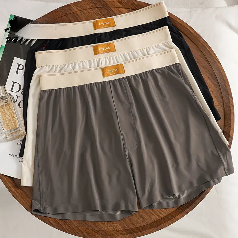 Three pairs of men's solid colour ice silk underwear showing loose fit and mid waist design