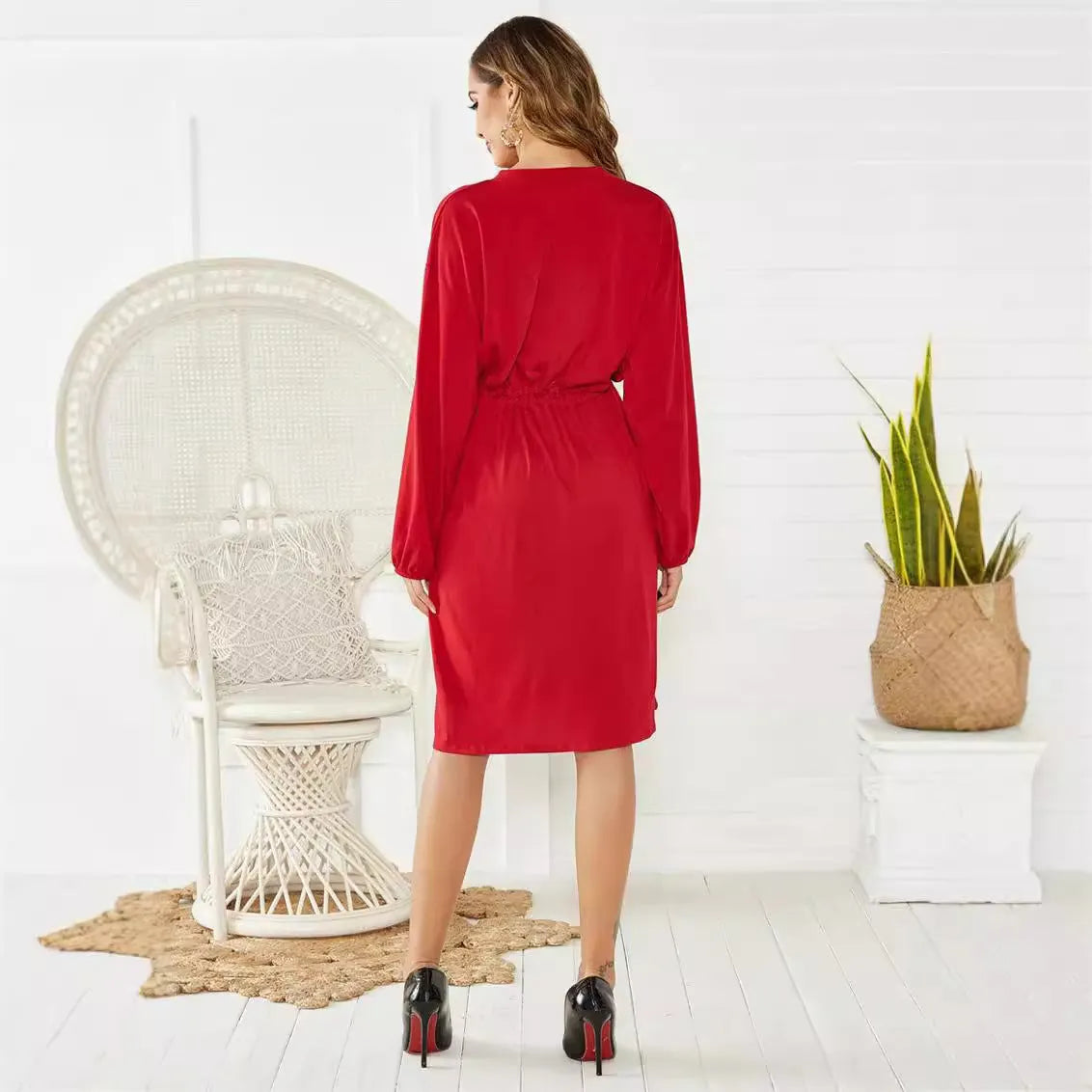 Black A-line midi dress with long sleeves, elastic waist, and a matching fabric belt.