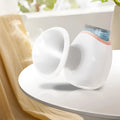 White portable eye humidifier with lithium battery power and charging cable