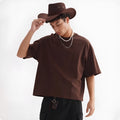 Loose fit pure cotton T-shirt in apricot colour on a hanger
