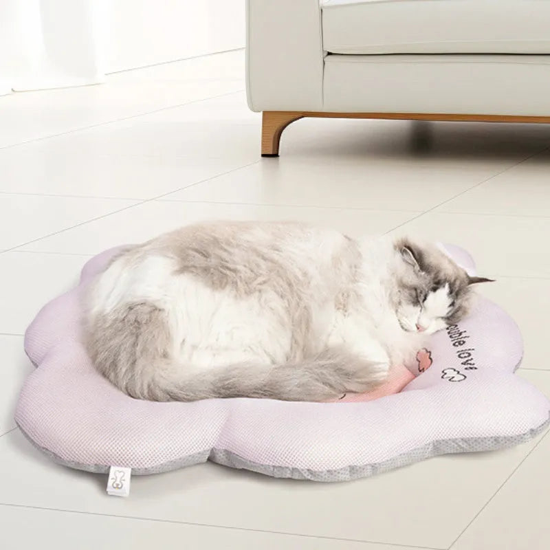 Green ice silk cooling mat for a medium-sized dog resting on the floor.