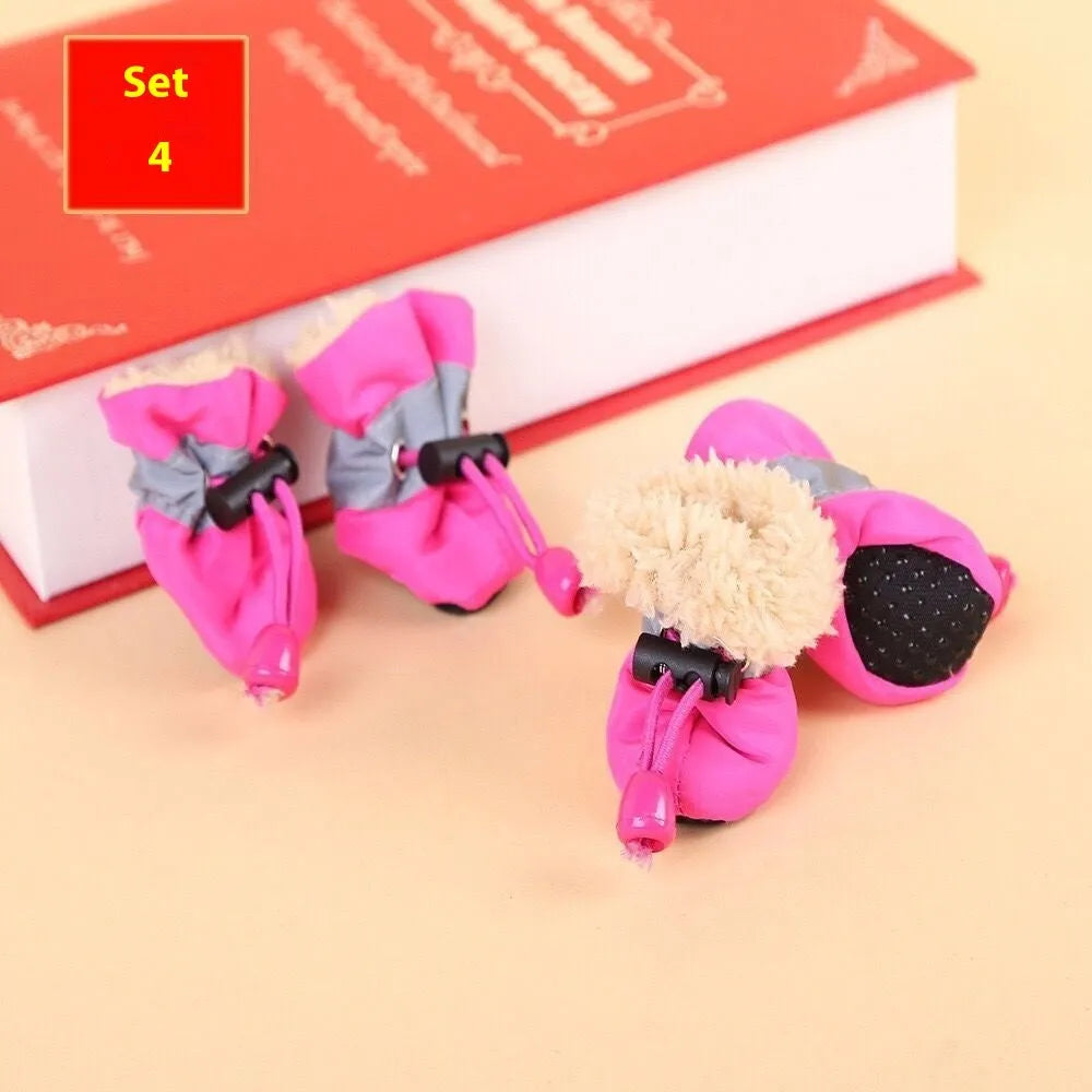 Set of four cloth dog shoes with soft soles in Rose Red colour showing non-slip bottoms