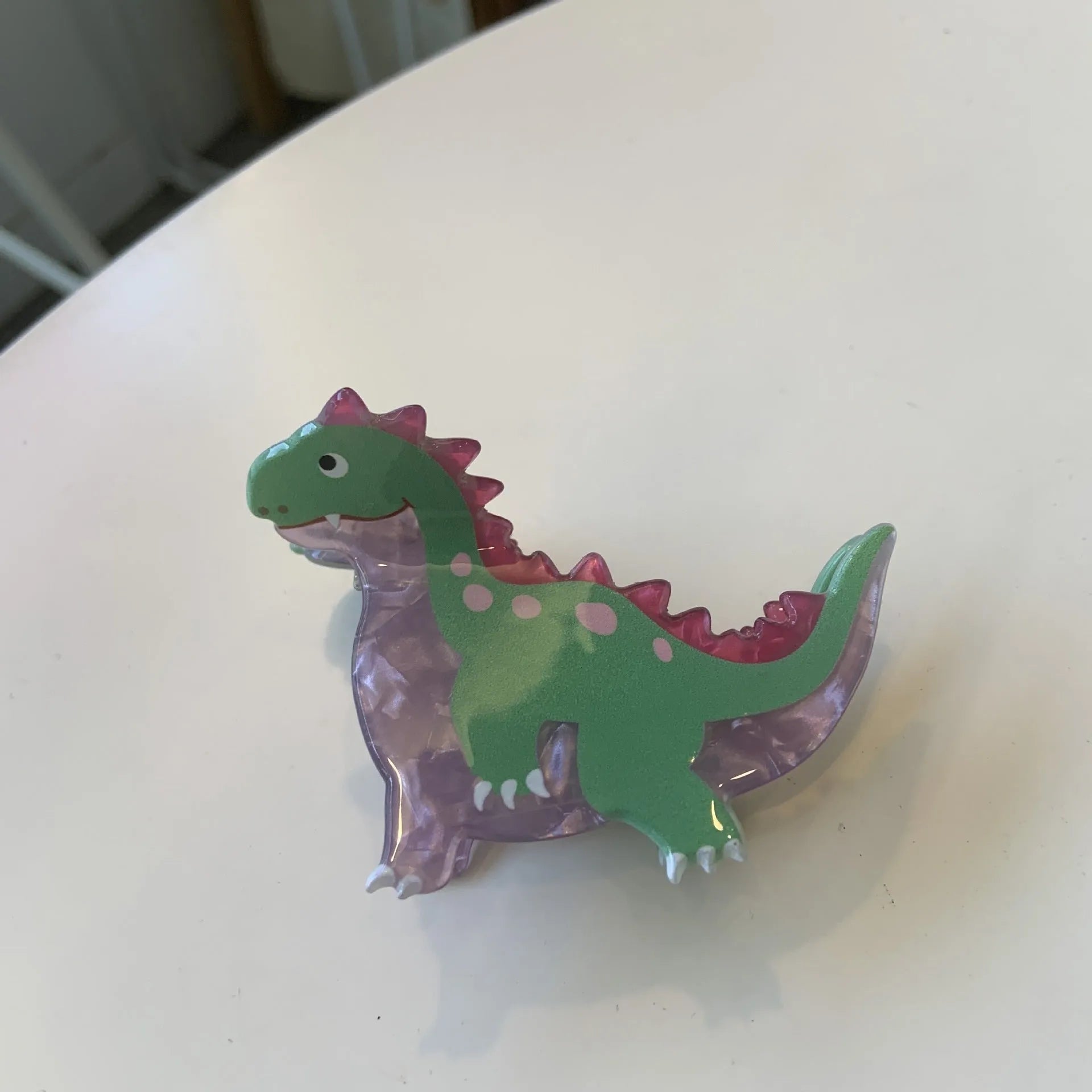 Acrylic dinosaur-themed hair clip with jaw grip design in one of six colour variations
