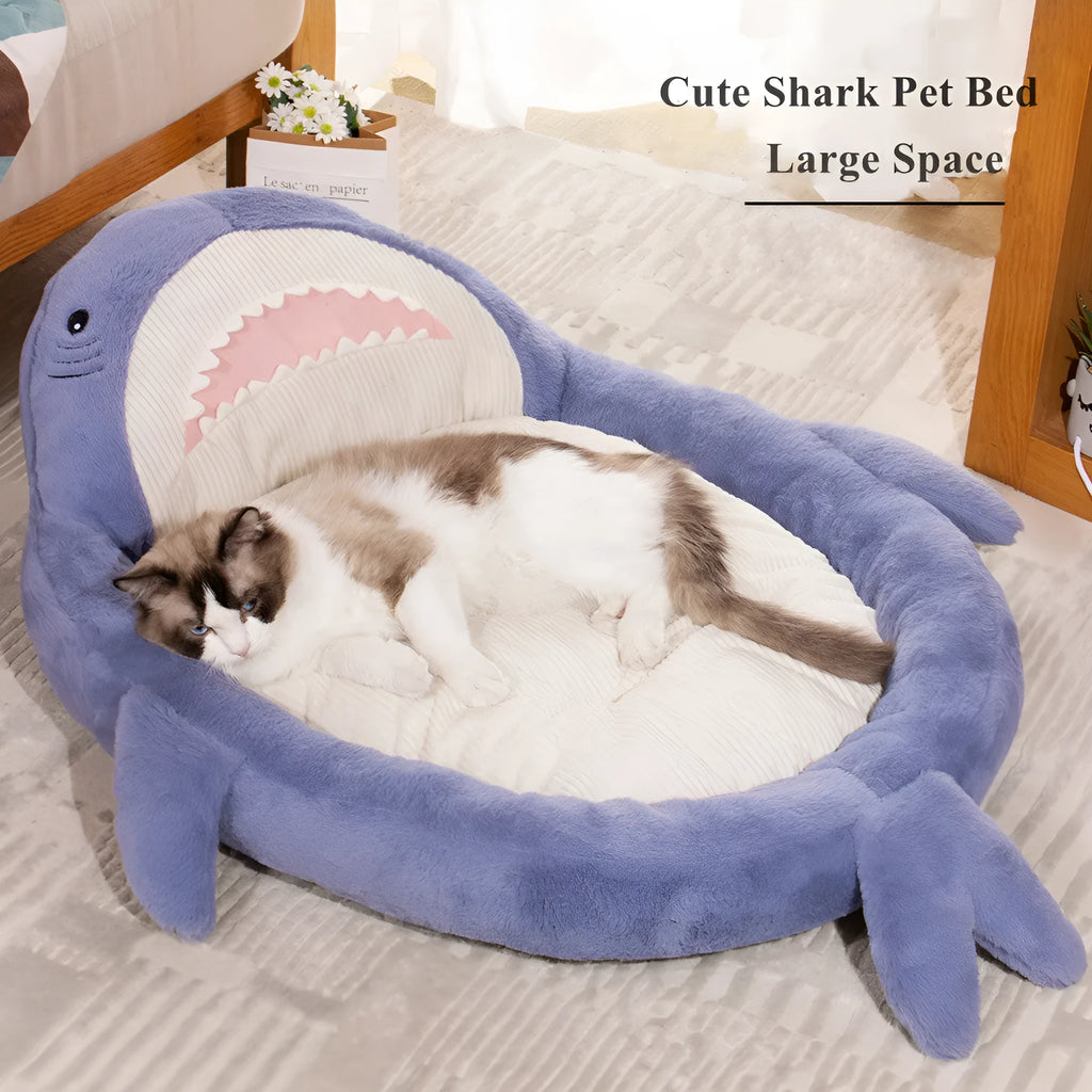 Blue shark pattern velvet pet bed cushion for dogs and cats on a wooden floor.