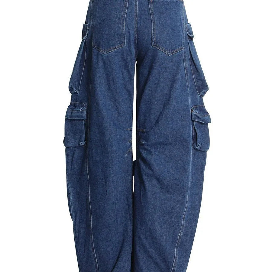 Dark blue distressed wide-leg denim jeans with high waist and multiple pockets laid flat.
