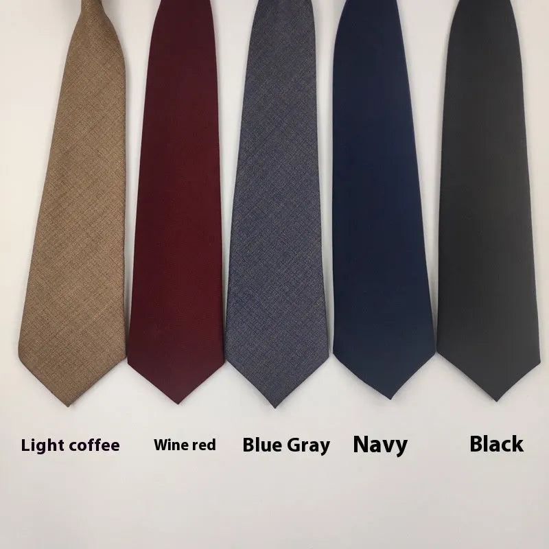 Men's solid colour cotton bow tie in arrow style, showing navy blue option.