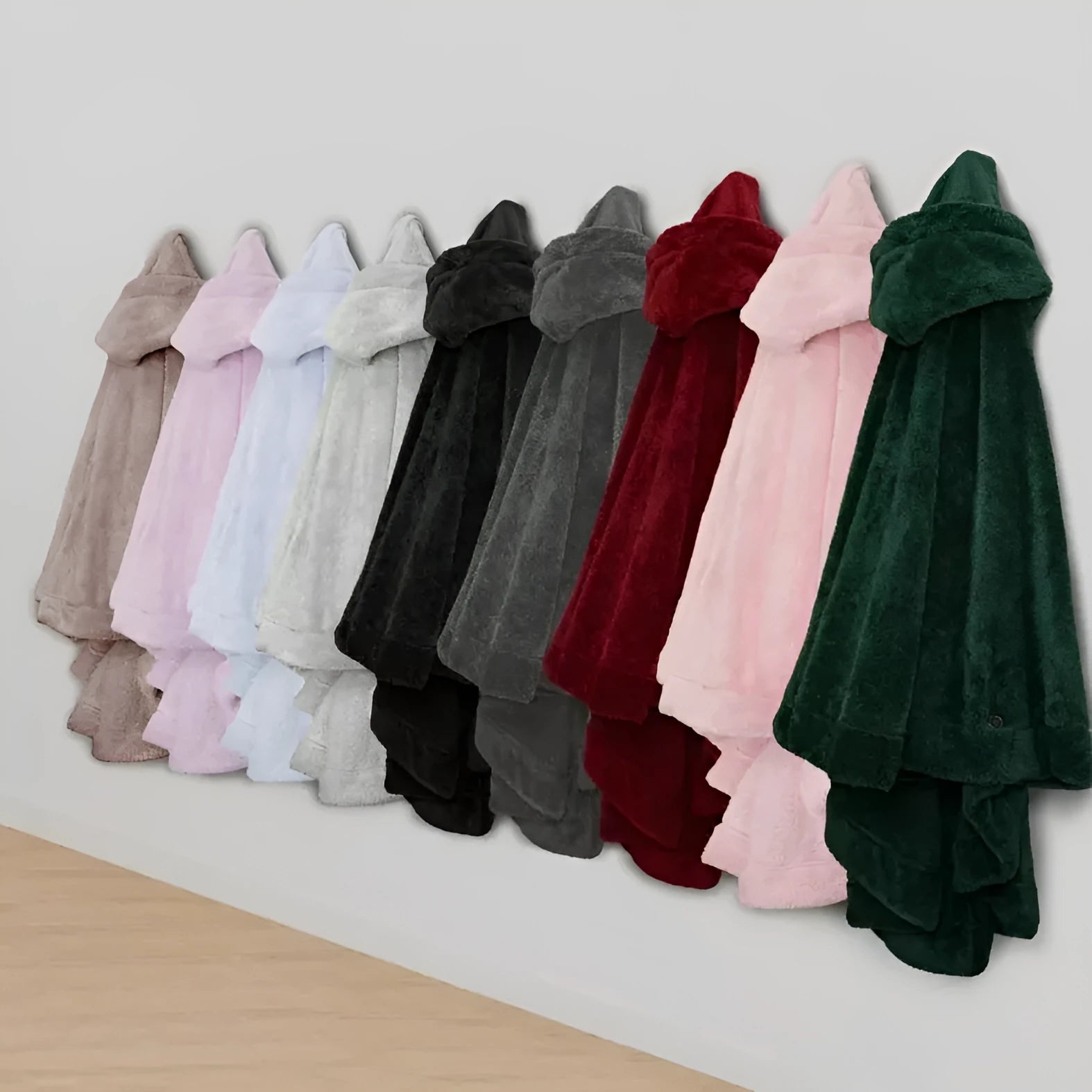 A heavy-weight hooded bathrobe in a cardigan style, shown in black, dark grey, and pink colour options.