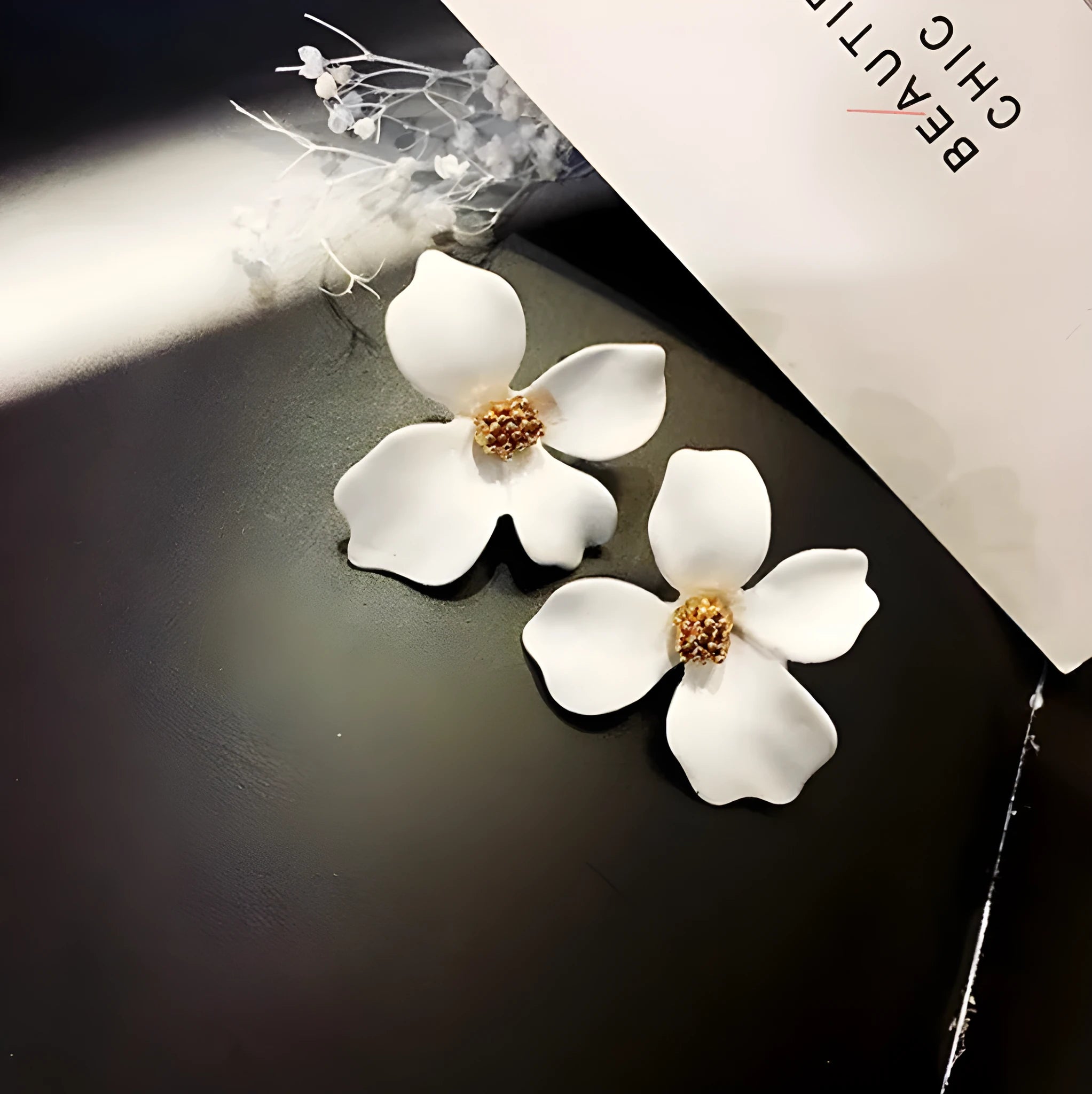 Flower shaped stud earrings for women in pink and white colours