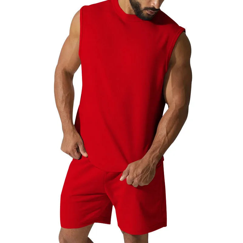 Men's sleeveless cotton blend sports suit showing top and shorts in a solid colour.