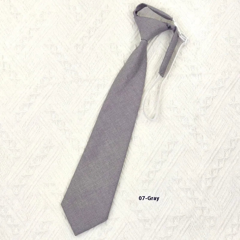 Men's solid colour cotton bow tie in arrow style, showing navy blue option.
