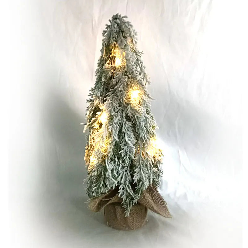 Small 24-inch artificial Christmas tree with snow-spray branches and built-in lights for desktop decoration