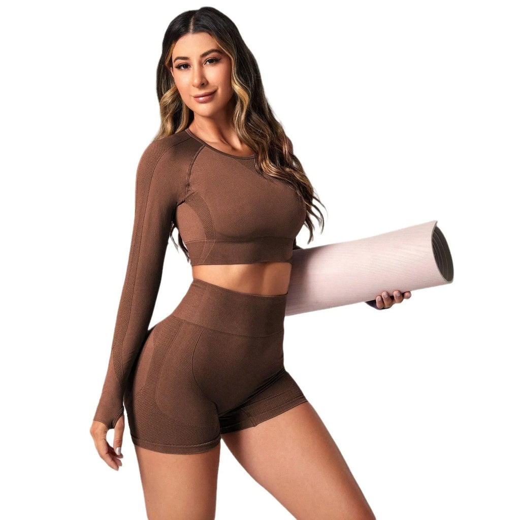 Women's high waist yoga suit in black, brown, or purple colours, showing pullover top and tight-fitting pants.