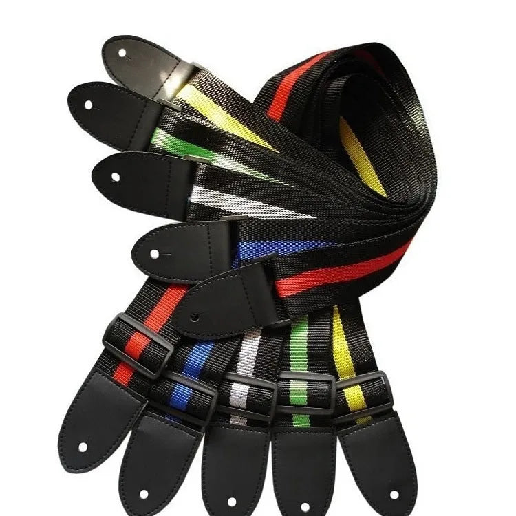 A woven crossbody guitar strap with a stripe pattern, shown attached to an electric guitar.