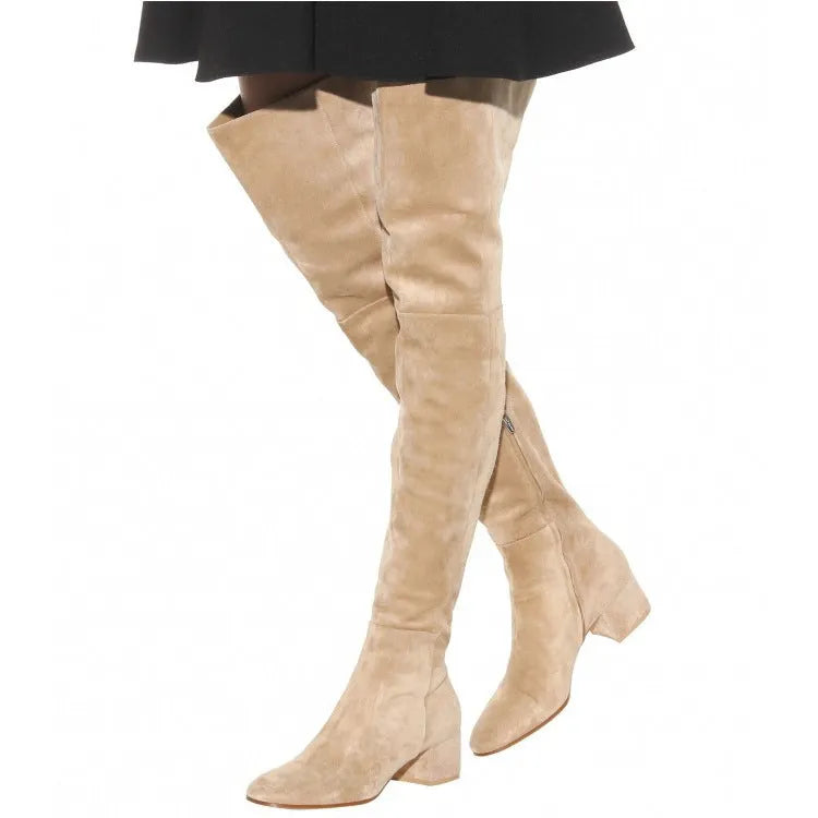 Grey suede women's over-the-knee flat boots with a low chunky heel and pointed toe.