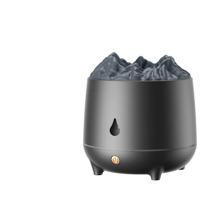 White volcano-shaped ultrasonic humidifier and aromatherapy diffuser on a table.