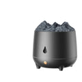 White volcano-shaped ultrasonic humidifier and aromatherapy diffuser on a table.