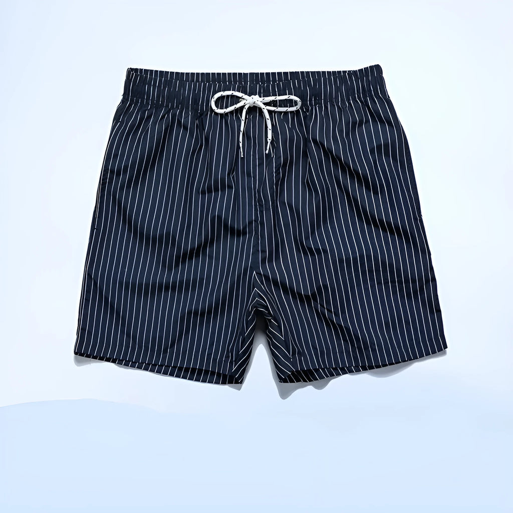 Navy blue striped beach shorts with straight legs on a mannequin.