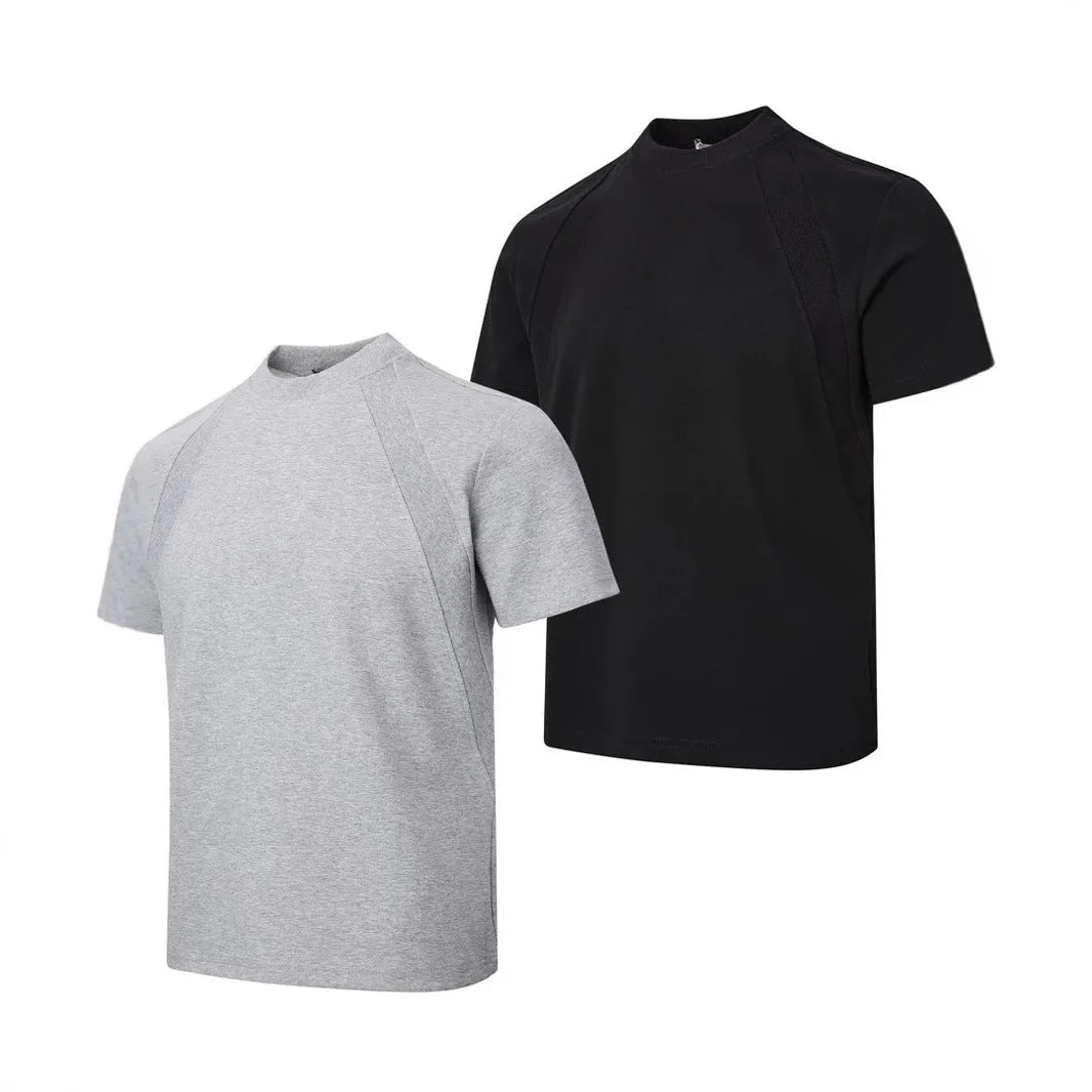 Black loose fit short sleeve top with air layer stitching detail on a hanger