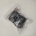 Black and red plastic seat belt buckle protector showing clip-on design.