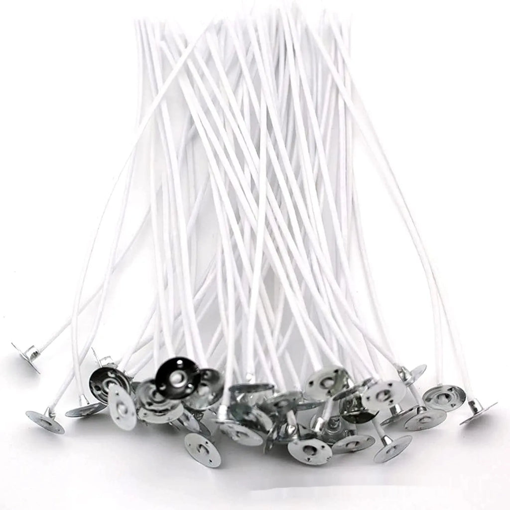 White cotton candle wicks showing tightly woven construction in three different lengths