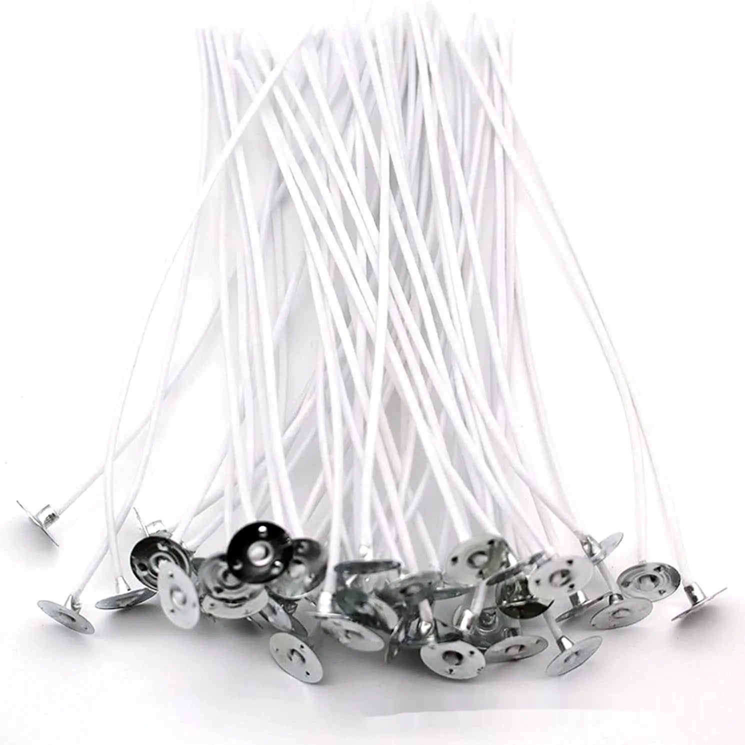 White cotton candle wicks showing tightly woven construction in three different lengths