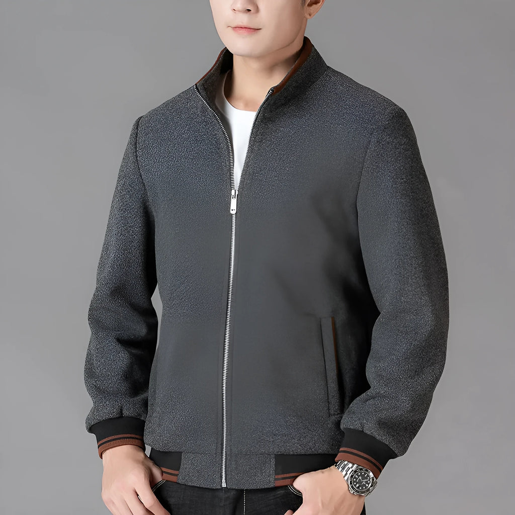 Men's grey sports-style fleece jacket with long sleeves and a stick pocket on the chest.
