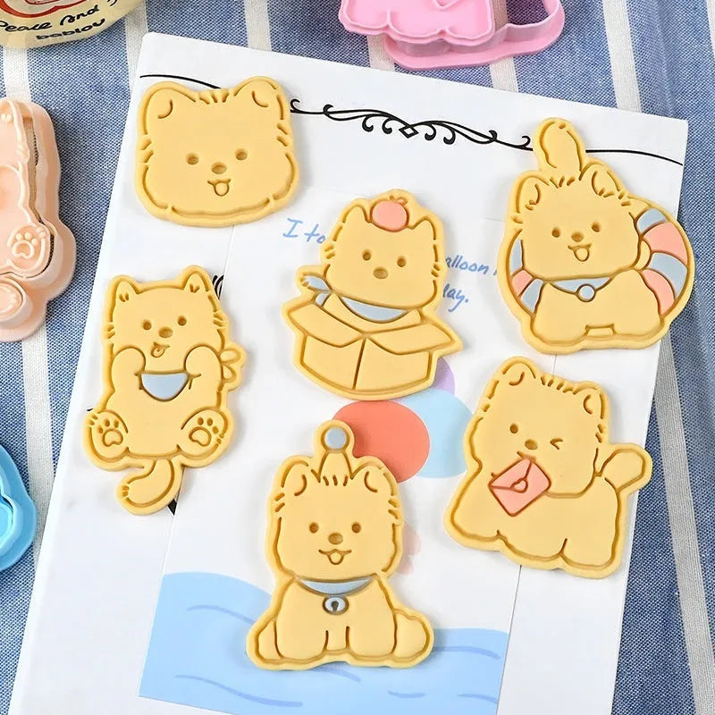 Plastic 3D cartoon puppy biscuit mould showing seven style variations including birthday hat and swimming ring designs