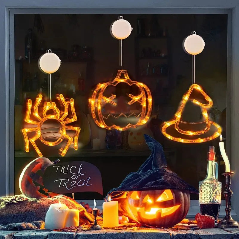 Halloween window hanging LED lights 7-piece set with spider pumpkin ghost designs on display