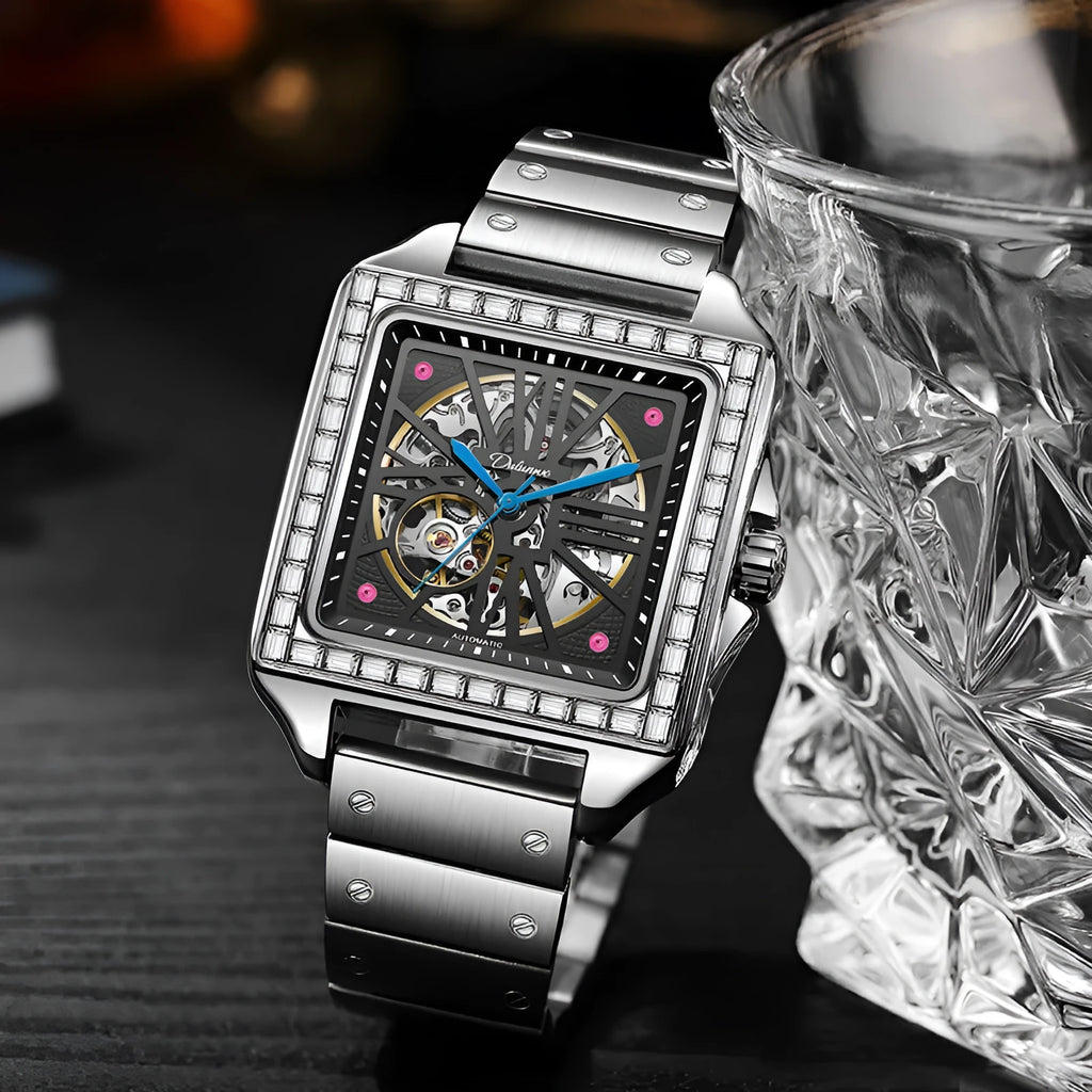 Men's square-faced automatic watch with diamond detailing on a stainless steel bracelet