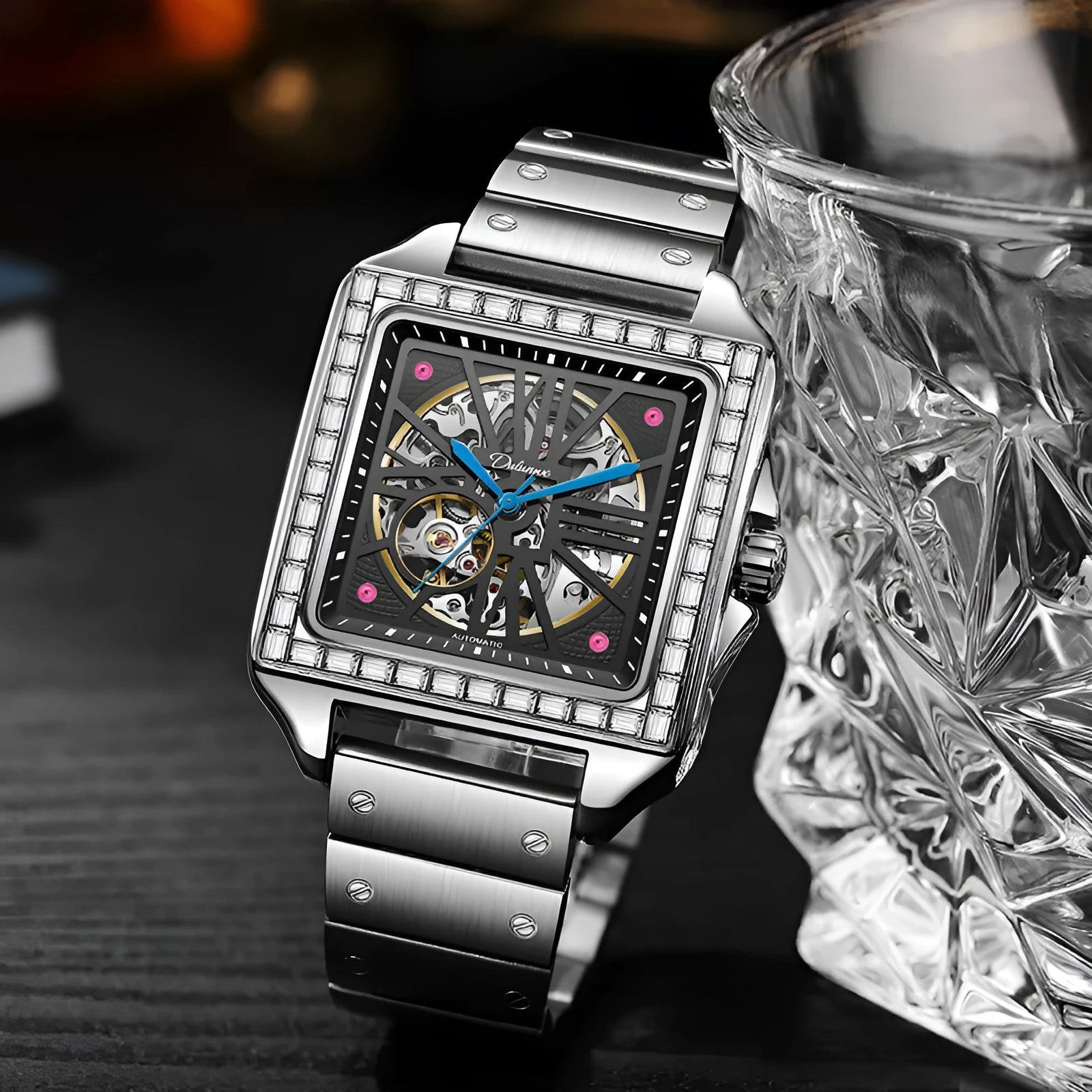 Men's square-faced automatic watch with diamond detailing on a stainless steel bracelet