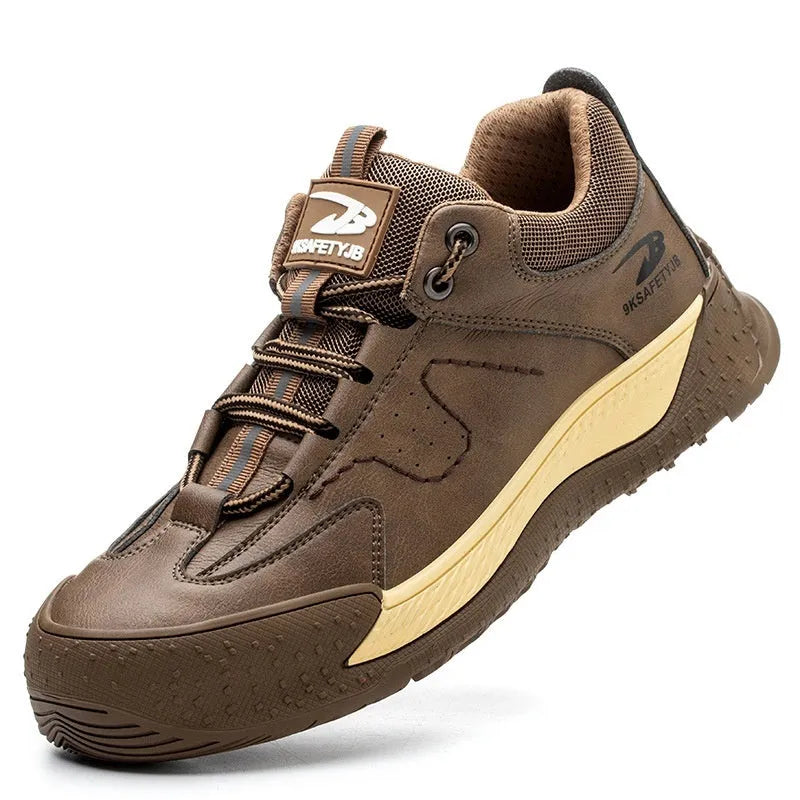 Men's black leather work safety shoe with Flyknit panel and rubber sole on a grey background.