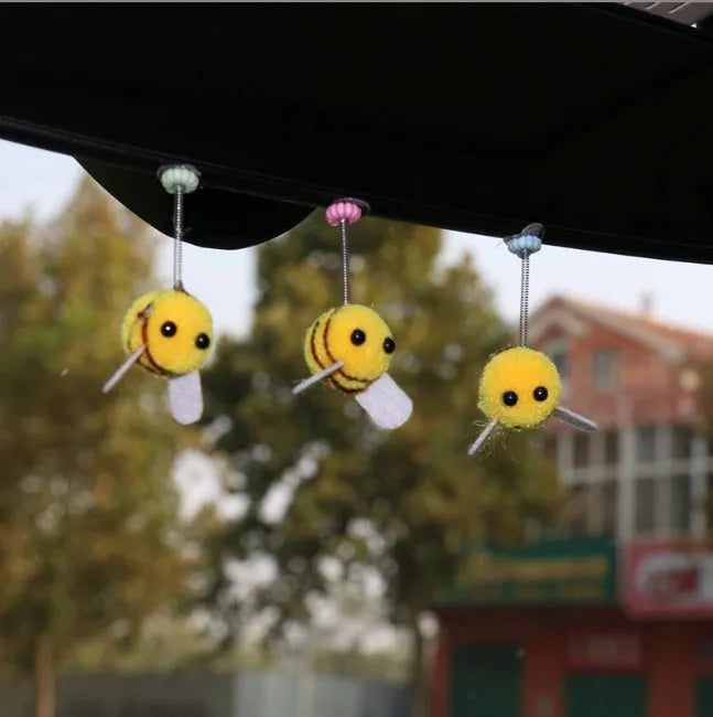 Square fur ball cartoon bee car decoration with black and yellow colours